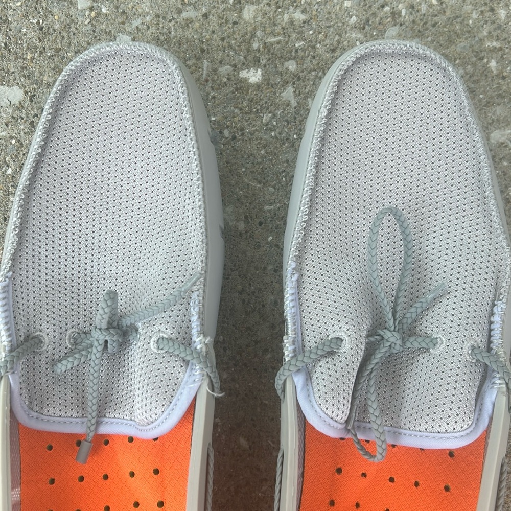 Like new swims, just has the tag worn off on the inside of one shoe. Size 14